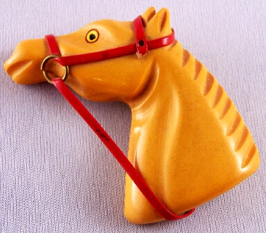 BP75 butterscotch bakelite horse head pin